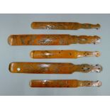 Five Japanese carved wooden page turners. The longest 40 cm long.