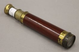 A Victorian wood and brass Victorian two-draw telescope. 32.5 cm long extended.