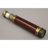 A Victorian wood and brass Victorian two-draw telescope. 32.5 cm long extended.