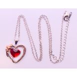 A silver heart pendant inscribed 'Always in my heart' on a silver chain, boxed.