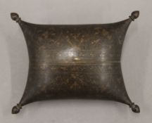An antique Persian engraved brass pillow-form box. 16 cm wide.