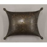 An antique Persian engraved brass pillow-form box. 16 cm wide.