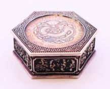 A Chinese hexagonal coin box. 6 cm wide.