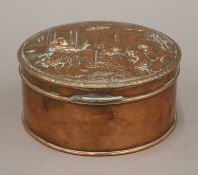 A 19th century copper embossed box. 14.5 cm diameter.