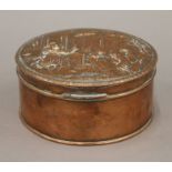 A 19th century copper embossed box. 14.5 cm diameter.