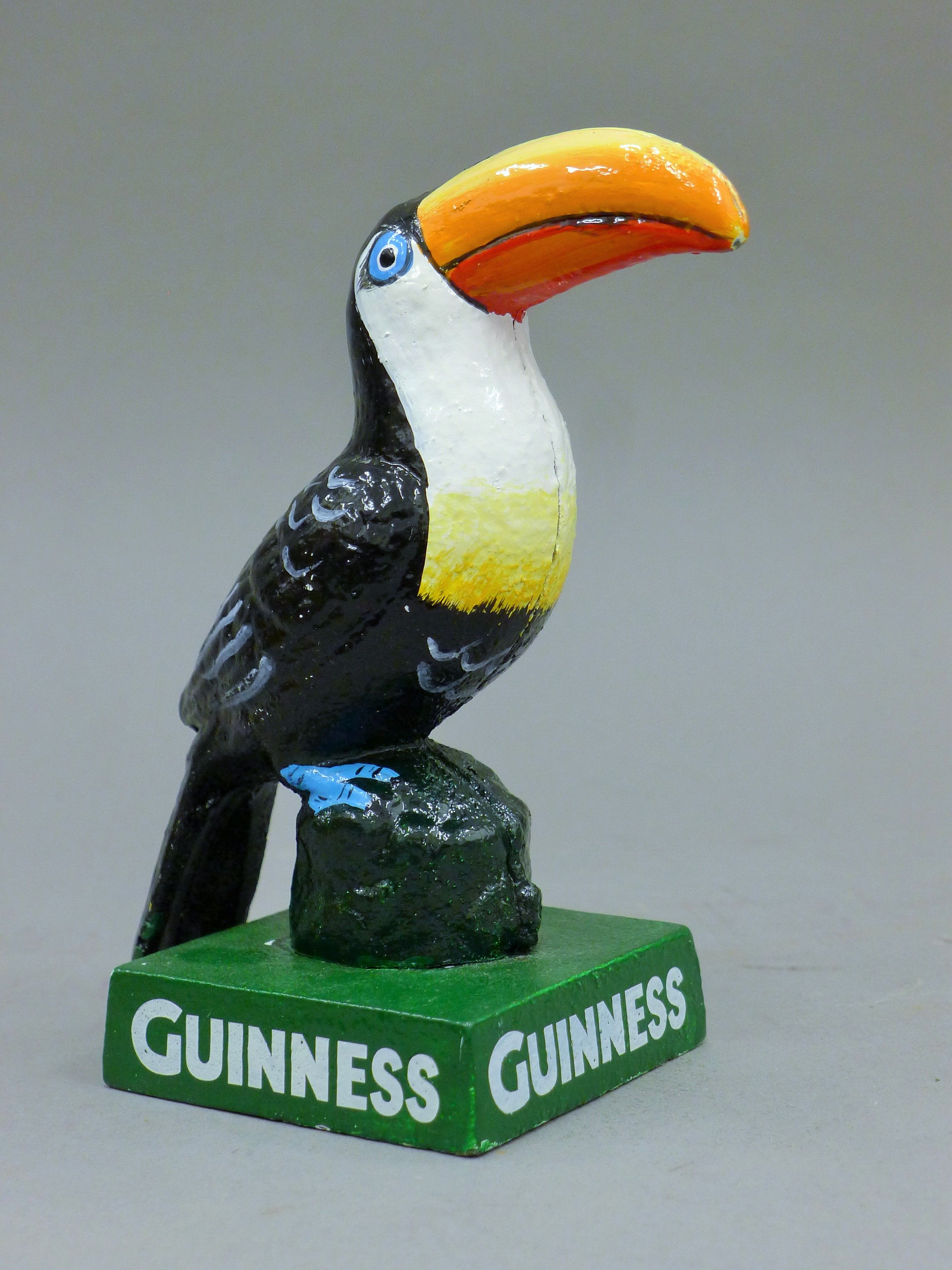 A cast iron Guinness toucan. 14.5 cm high.