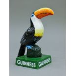 A cast iron Guinness toucan. 14.5 cm high.