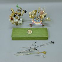 A quantity of late 19th/early 20th century hat pins in two pin cushions and a quantity of golf hat