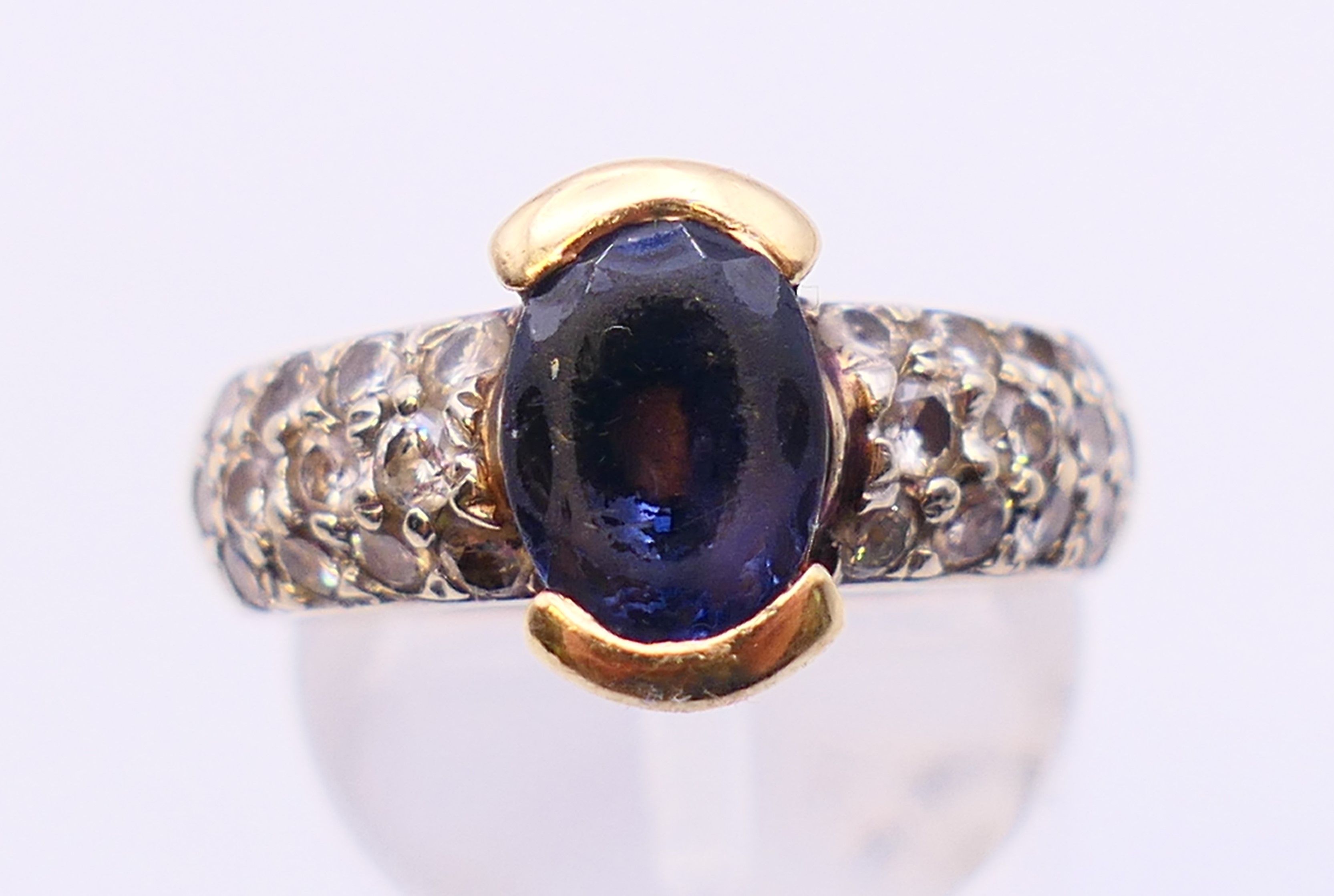 A 14 K gold, diamond and amethyst ring. Ring size M/N.