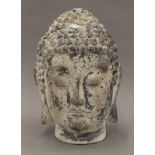 A rustic buddha head. 35 cm high.