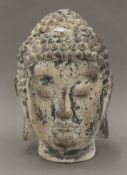 A rustic buddha head. 35 cm high.