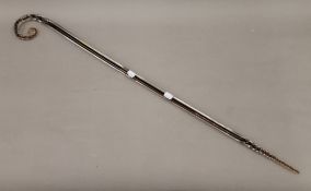 A glass walking stick with twisted handle and base. 95.5 cm high.