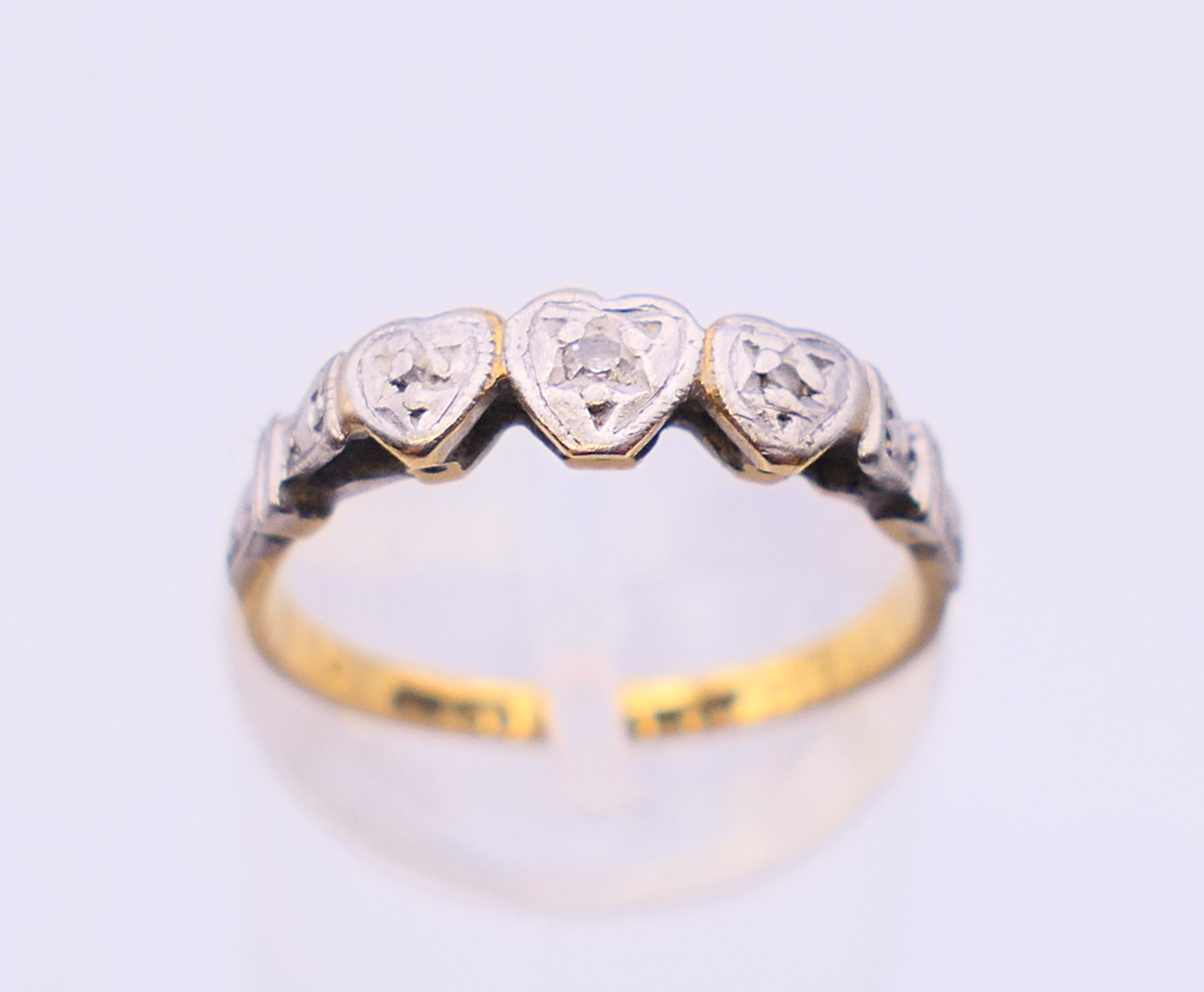 Three various gold, diamond, sapphire and emerald set rings. 4.5 grammes total weight. - Image 9 of 20