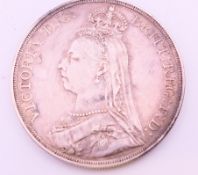 An 1887 Queen Victoria silver crown coin.