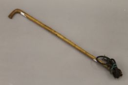 A Victorian carved rhino horn riding whip. Approximately 135 cm long in total.
