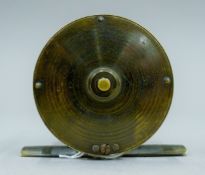 An Army and Navy 2 1/4" brass trout fly reel engraved "105 Victoria Street, SW".