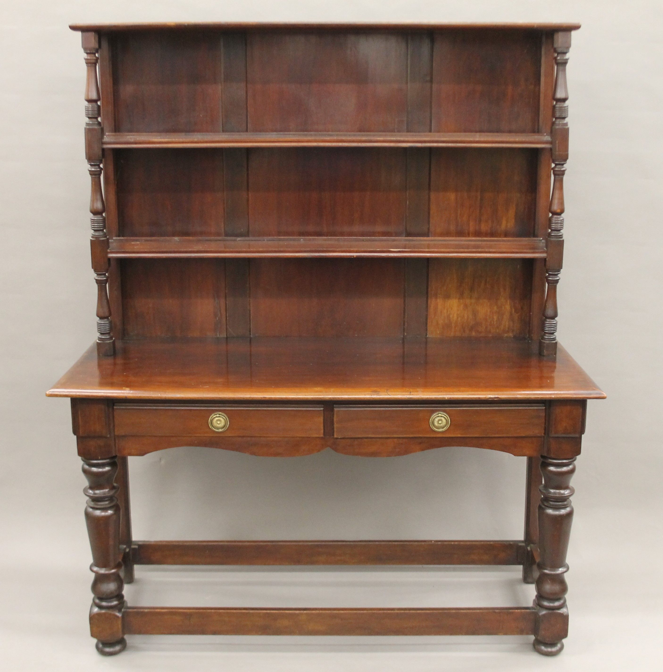 A 19th century fruitwood and mahogany dresser. 129 cm wide x 156 cm high.