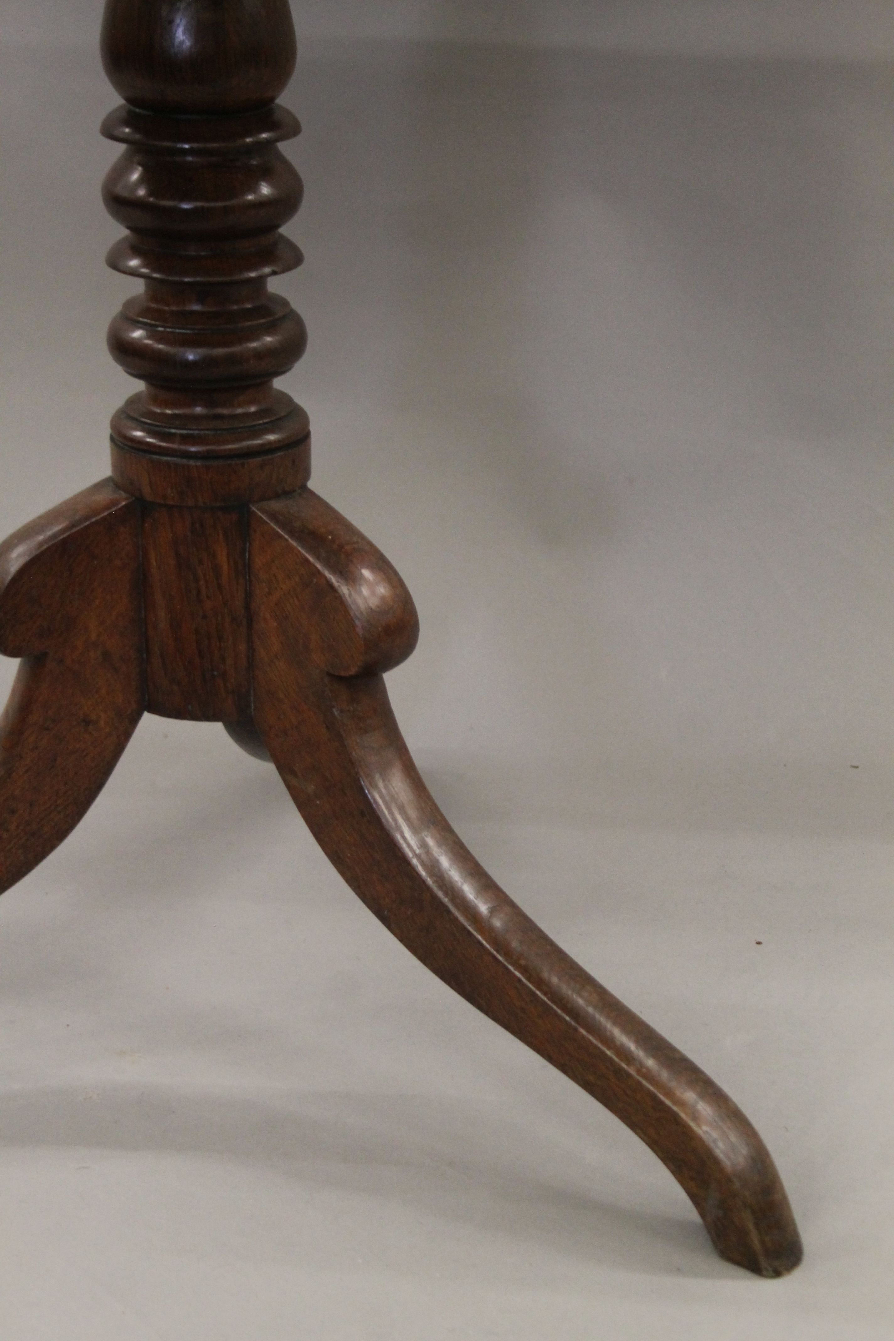 A 19th century oak tilt top tripod table, - Image 4 of 5