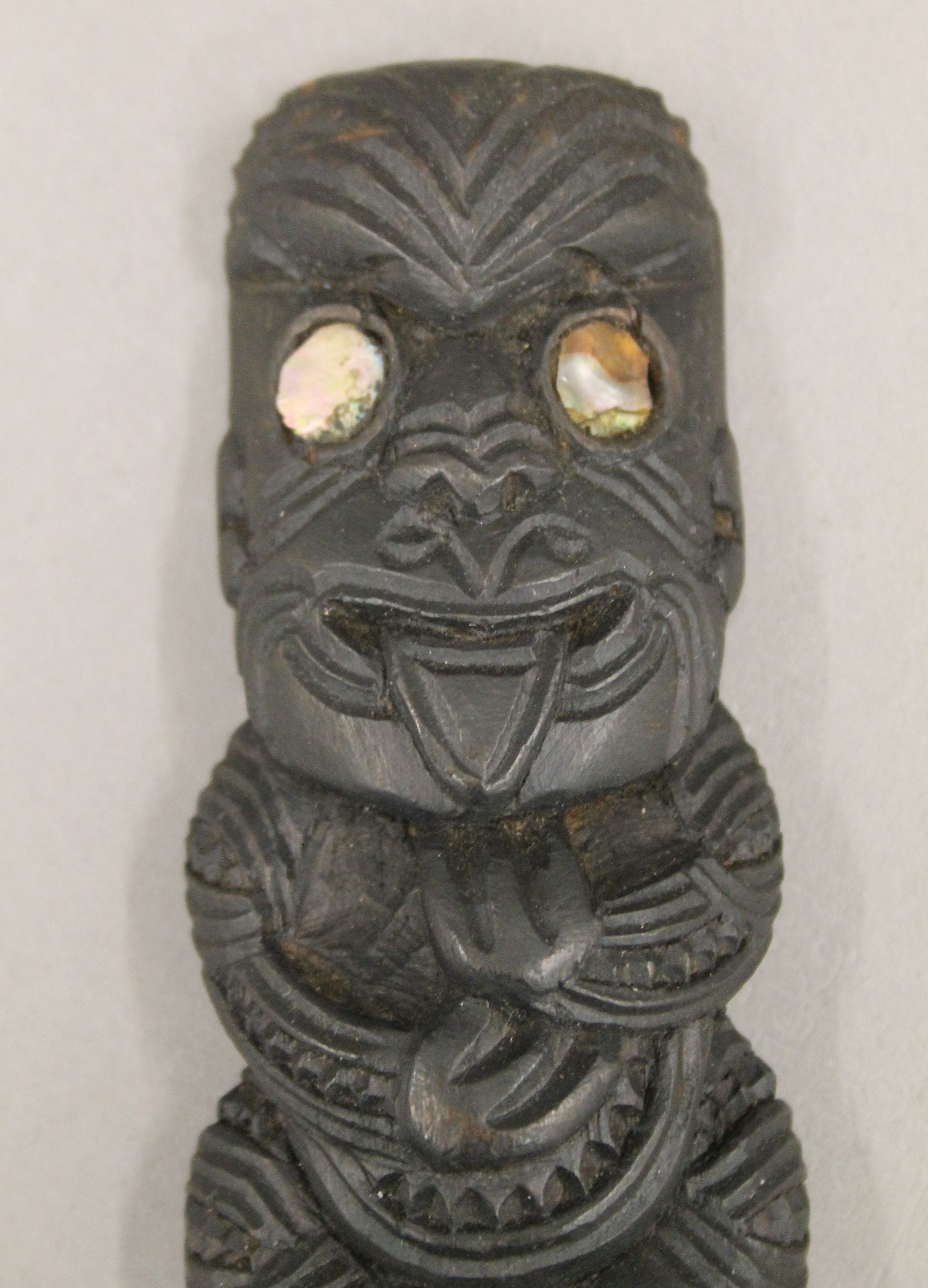 A carved wooden Maori Tiki with inset abalone shell eyes. 16 cm high. - Image 2 of 5