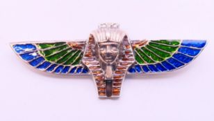 A silver Art Deco style winged Pharaoh brooch. 8 cm x 3 cm.