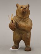 A small Blackforest carved wooden bear. 11 cm high.