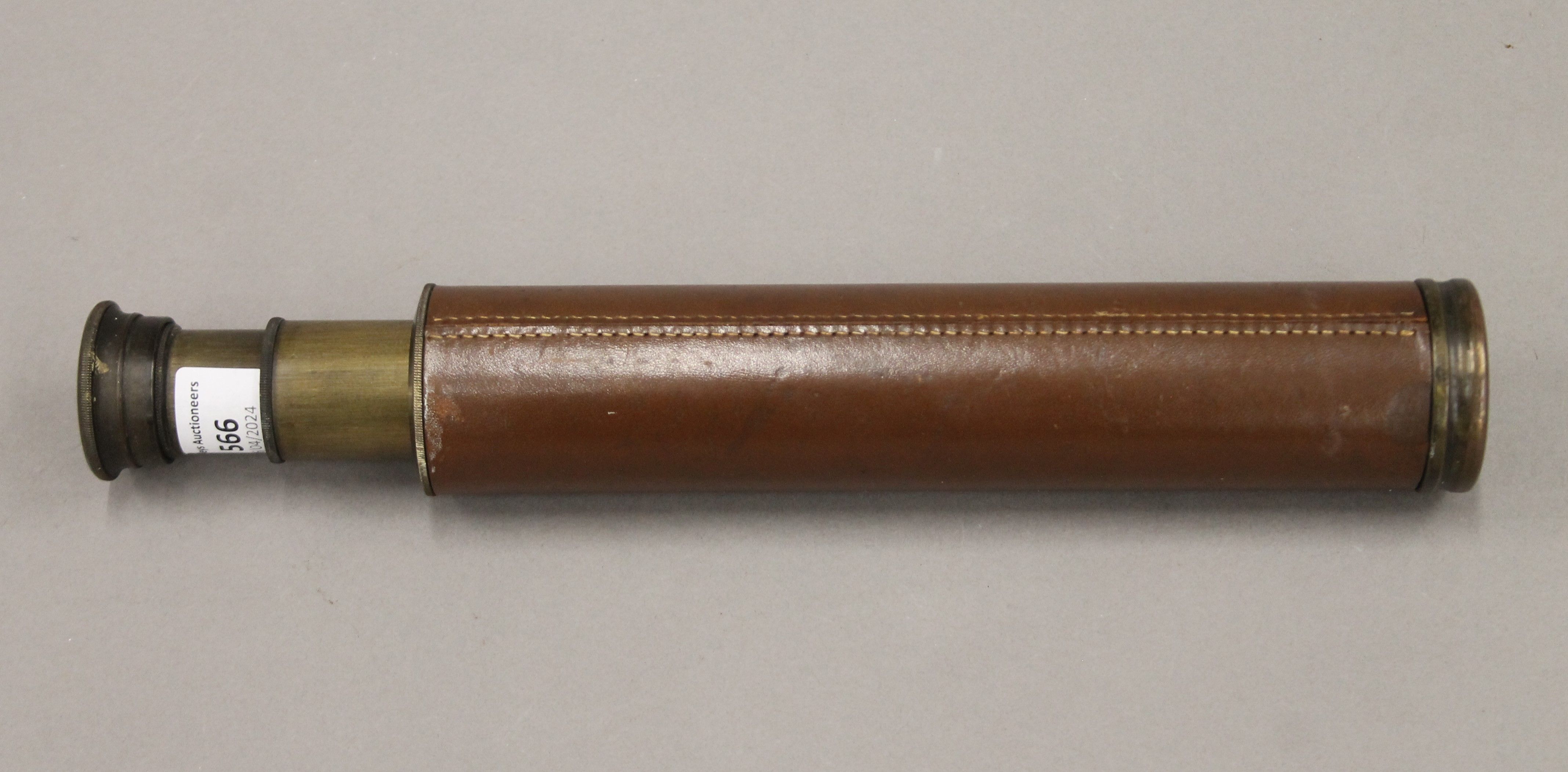 A leather-bound brass three-draw telescope, stamped Rangers Enbeeco, London. 69 cm long extended. - Image 2 of 6