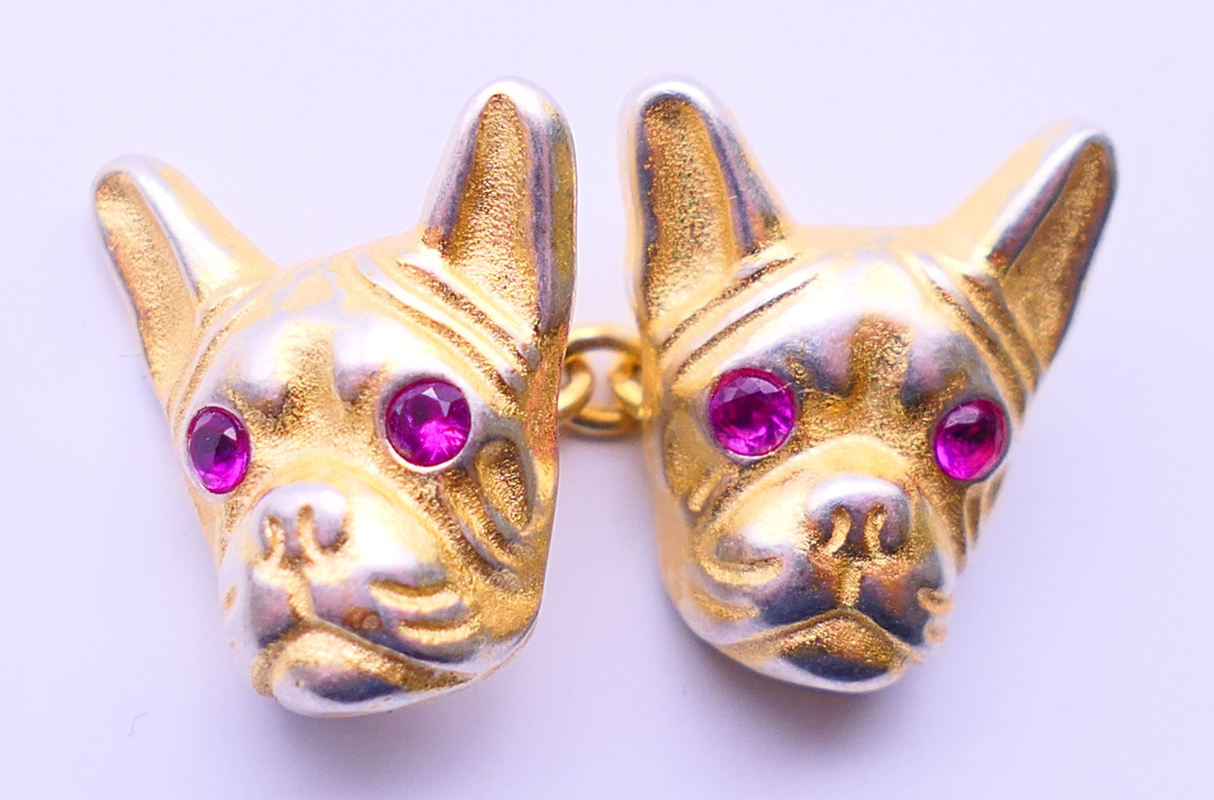 A pair of silver gilt dog head form cufflinks with Russian marks. 1.5 cm high. - Image 2 of 3