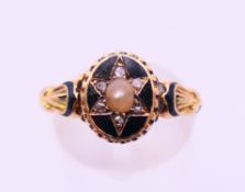 An 18 ct gold, enamel, diamond and pearl 'in memory of' ring, hallmarked for London 1870,