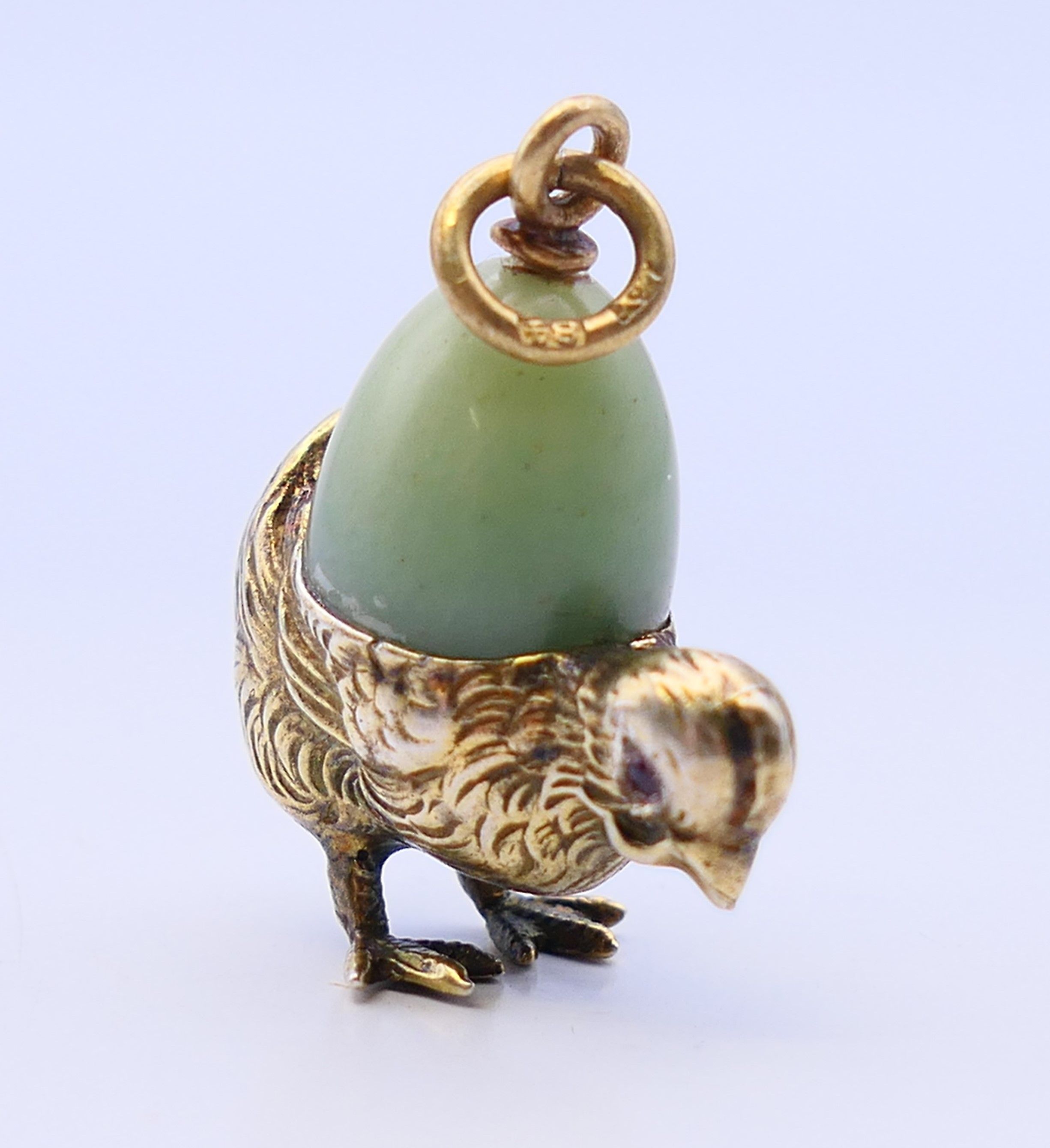 A silver and jade chick and egg pendant, bearing Russian marks. 2.5 cm high. - Image 2 of 3