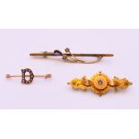 Three 9 ct gold brooches, one with pearls set within a 'D', all boxed. The largest 6 cm long. 5.