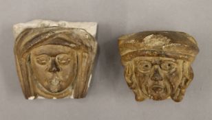 Two antique, possibly Medieval, carved stone faces. The largest 6.5 cm high.