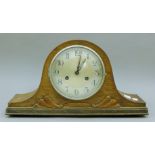 An oak wall clock, another wall clock and an oak mantle clock. The former 64 cm high.