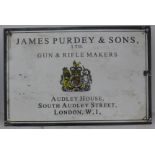 An enamel Purdey sign. 38 cm x 25.5 cm.