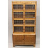 A five-stack lead-glazed oak Minty bookcase. 89 cm wide x 174 cm high x 37.5 cm deep.