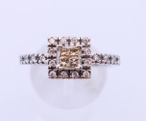 A 9 ct white gold and diamond cluster ring. Ring size S.