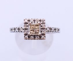 A 9 ct white gold and diamond cluster ring. Ring size S.