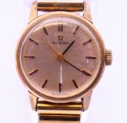 An Omega gold cased ladies wristwatch 28.1 grammes total weight. 2 cm diameter.