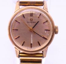 An Omega gold cased ladies wristwatch 28.1 grammes total weight. 2 cm diameter.