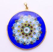 An 18 ct gold-mounted Venetian glass millefiori pendant. 3.75 cm diameter.