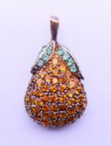 A silver pendant in the form of a pear. 3 cm high.