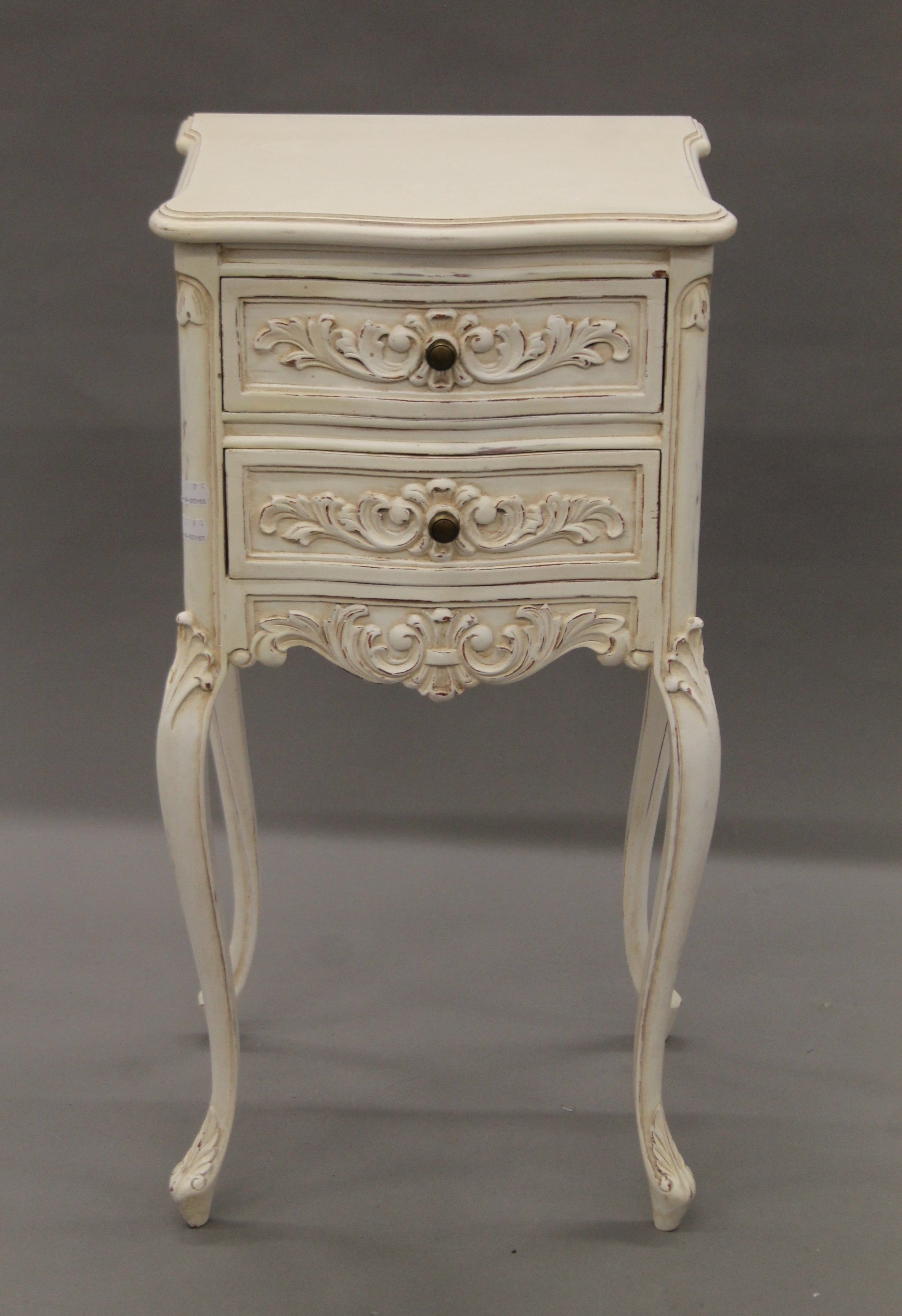 A set of white painted bedside drawers. 36 cm wide.