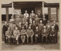 An early 20th century photograph of a committee before a pavilion from the Ely and Cambridge area.