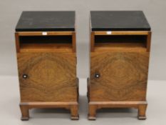 An early 20th century walnut cupboard over drawers and a pair of walnut pot cupboards.