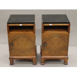 An early 20th century walnut cupboard over drawers and a pair of walnut pot cupboards.