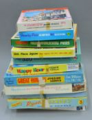 A quantity of various jigsaw puzzles.