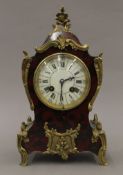 An early 20th century faux tortoiseshell mantle clock. 29 cm high.