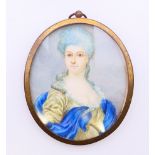 A 19th century hand-painted miniature portrait on ivory of a lady in a blue and olive-coloured