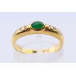 An 18 ct gold, emerald and diamond five-stone ring. Ring size M/N.