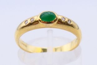 An 18 ct gold, emerald and diamond five-stone ring. Ring size M/N.