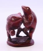 A netsuke in the form of two frogs. 5.5 cm high.